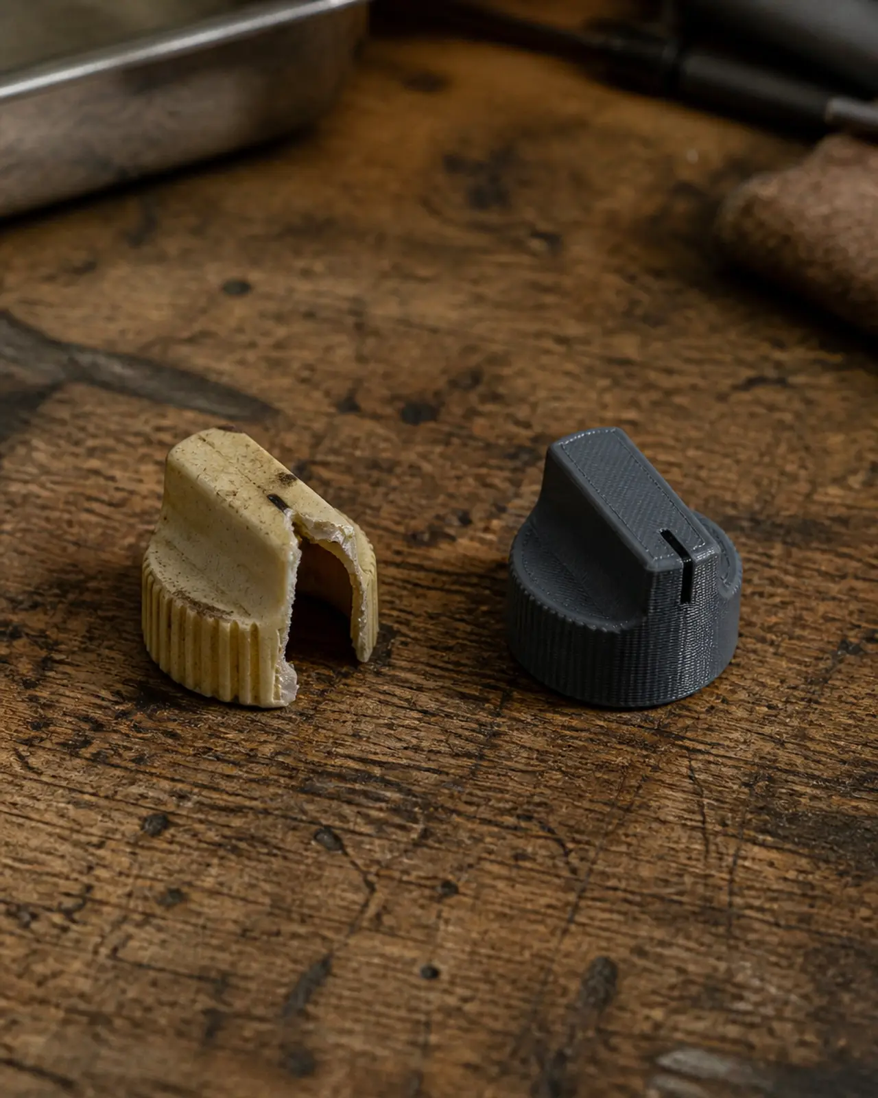 A broken vintage knob next to a fresh 3D printed replacement